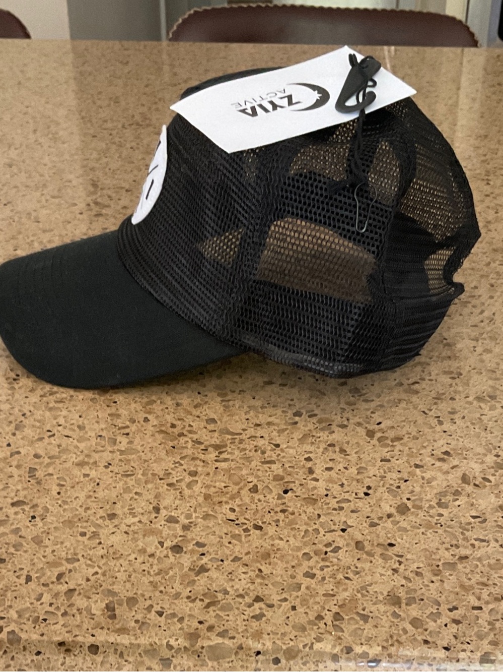 Black Mesh Trucker Hat with White Circular Logo Patch - Picture 3 of 3